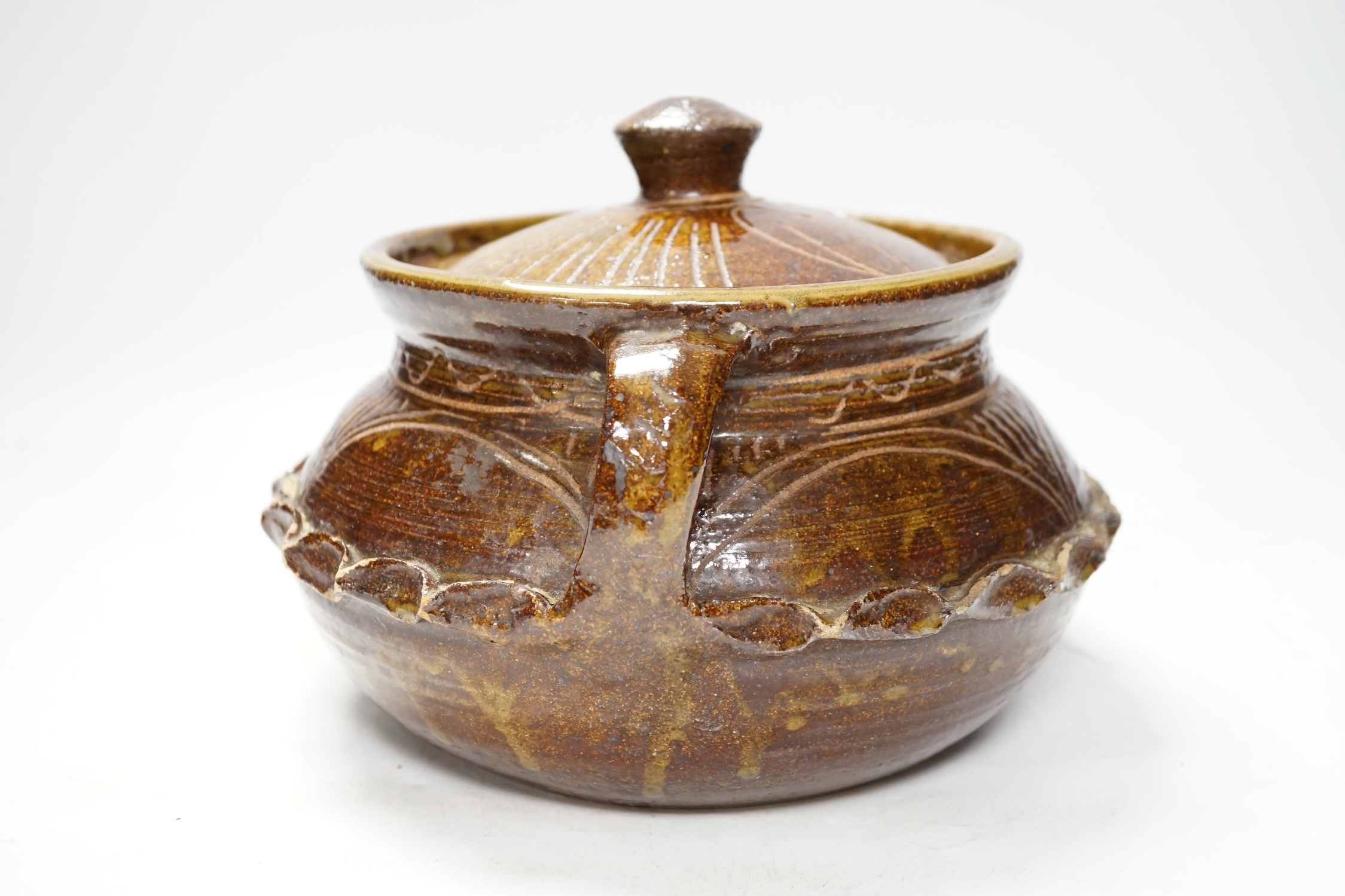 A Wenford Bridge stoneware jar and cover, Gwari, by Michael Cardew, 18cm. Condition - fair, some wear to glaze.